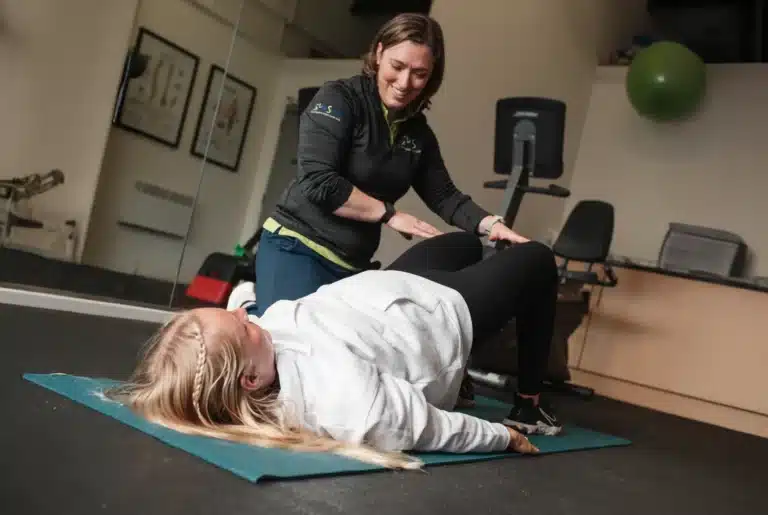Sara from Insync Therapy working with a pilates